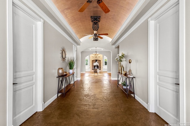 23954 Cibolo Vw, San Antonio, TX 78266 - hall featuring crown molding, arched walkways, concrete flooring, vaulted ceiling, and baseboards