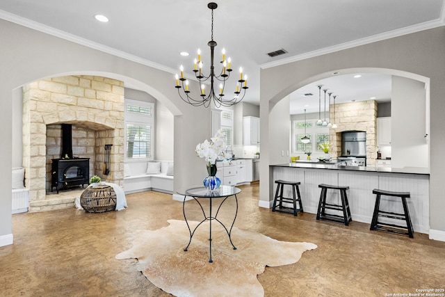 23954 Cibolo Vw, San Antonio, TX 78266 - dining room featuring crown molding, visible vents, a wood stove, and recessed lighting