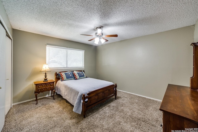 2910 Bee Cave, San Antonio, TX 78231 - bedroom featuring a closet, carpet floors, baseboards, a ceiling fan, and a textured ceiling