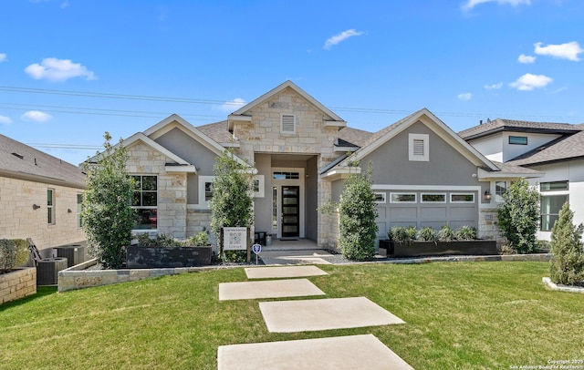 craftsman inspired home with an attached garage, roof with shingles, stone siding, and a front lawn