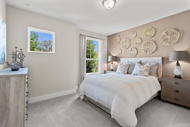 bedroom with carpet and baseboards
