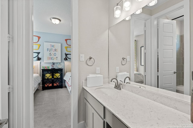 full bathroom with connected bathroom and vanity