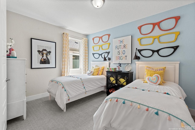 carpeted bedroom featuring baseboards