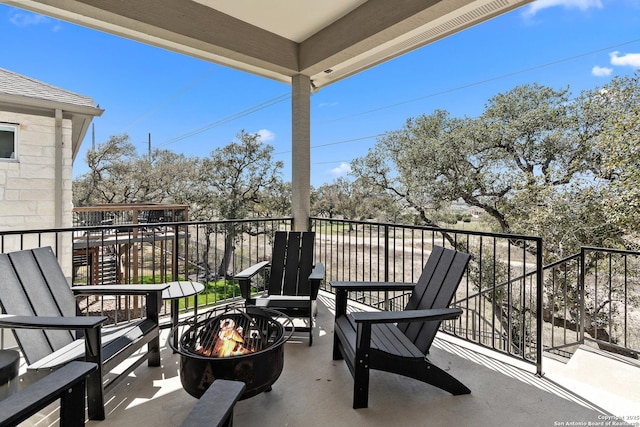 balcony featuring a fire pit