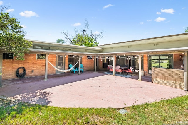 800 Eventide, Terrell Hills, TX 78209 - rear view of house with a patio and brick siding