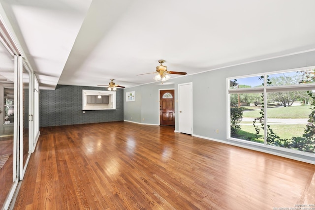 800 Eventide, Terrell Hills, TX 78209 - unfurnished living room with baseboards, a ceiling fan, and wood finished floors