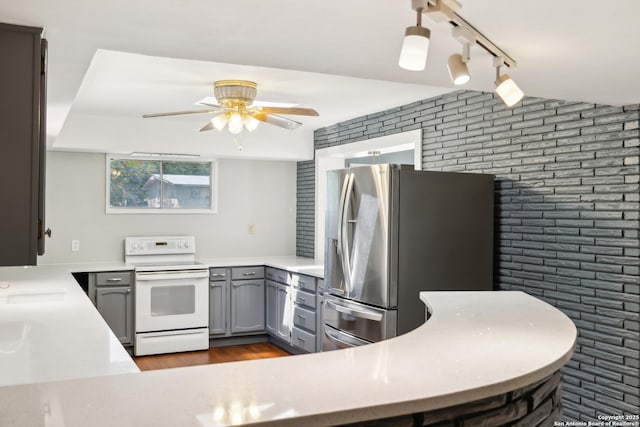 800 Eventide, Terrell Hills, TX 78209 - kitchen featuring brick wall, stainless steel refrigerator with ice dispenser, gray cabinets, a ceiling fan, and white electric stove