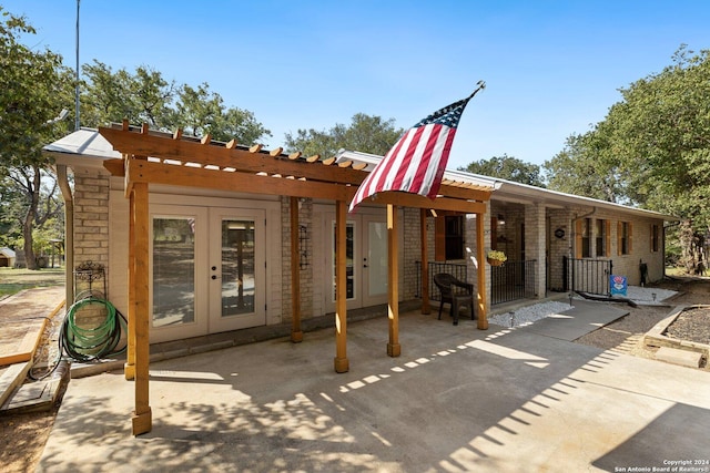 296 Wolf Ln, La Vernia, TX 78121 - rear view of house featuring french doors, a patio, and a pergola