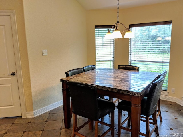 20918 Cactus Rdg, San Antonio, TX 78258 - tiled dining room with a chandelier and baseboards