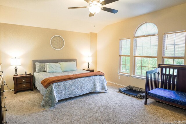carpeted bedroom featuring baseboards, a ceiling fan, and lofted ceiling