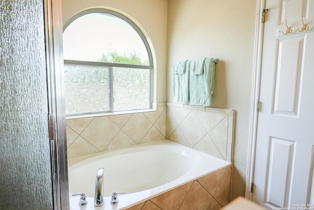 full bath with a garden tub