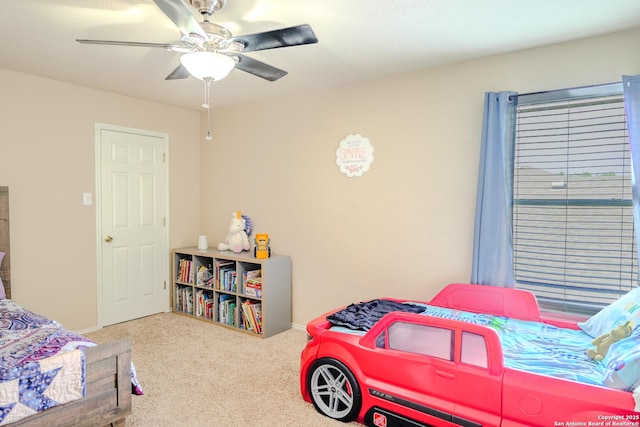 bedroom with baseboards, a ceiling fan, and carpet flooring