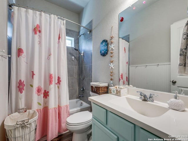 bathroom with shower / bath combo, vanity, toilet, and wood finished floors