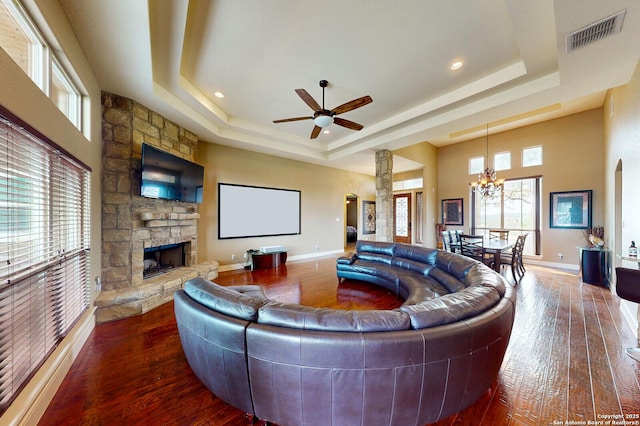 224 E Copper Trce, New Braunfels, TX 78132 - living room with visible vents, decorative columns, a fireplace, a tray ceiling, and hardwood / wood-style floors