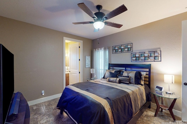 224 E Copper Trce, New Braunfels, TX 78132 - bedroom featuring baseboards, ceiling fan, ensuite bath, and stone finish flooring