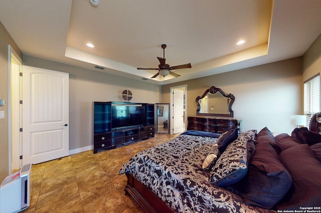 224 E Copper Trce, New Braunfels, TX 78132 - bedroom featuring a tray ceiling, ceiling fan, visible vents, and recessed lighting