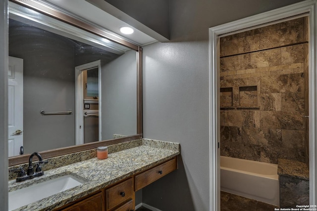 bathroom with vanity and  shower combination