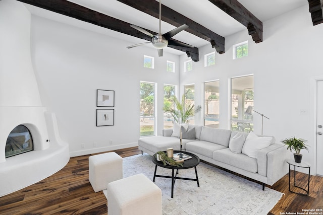 19211 Tierra Cv, San Antonio, TX 78258 - living room with baseboards, a high ceiling, a ceiling fan, beamed ceiling, and wood finished floors