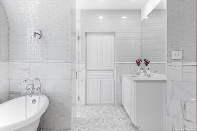 19211 Tierra Cv, San Antonio, TX 78258 - full bath featuring a freestanding tub, vanity, and tile walls