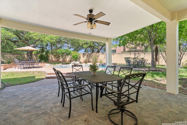 19211 Tierra Cv, San Antonio, TX 78258 - view of patio / terrace with outdoor dining space, a fenced in pool, a fenced backyard, and ceiling fan