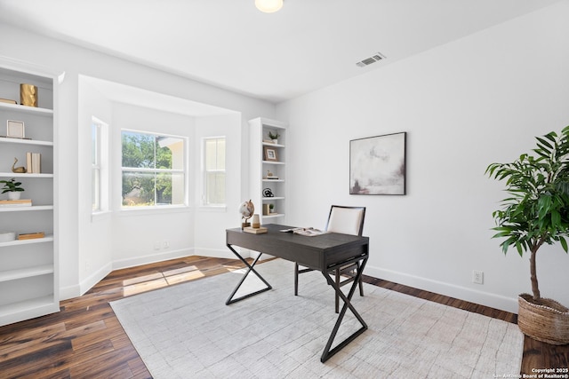 19211 Tierra Cv, San Antonio, TX 78258 - office area with visible vents, baseboards, and wood finished floors