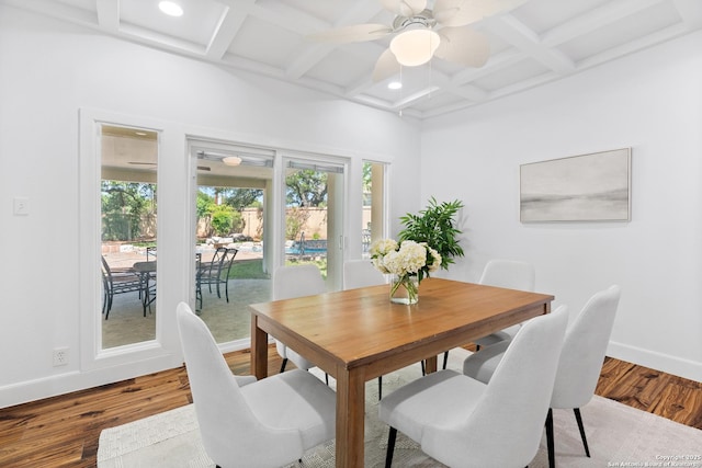 19211 Tierra Cv, San Antonio, TX 78258 - dining space featuring baseboards, ceiling fan, coffered ceiling, and wood finished floors