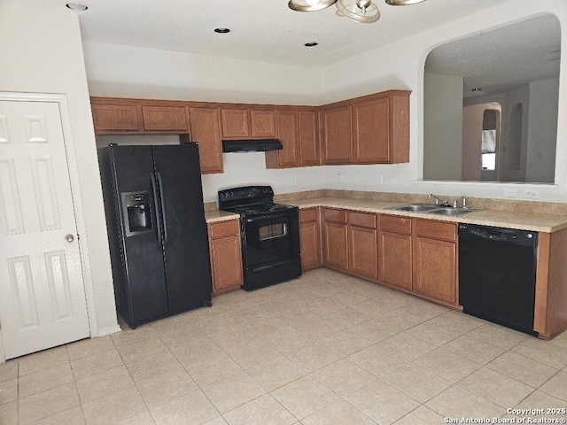 5334 Lowry Peterson, San Antonio, TX 78227 - kitchen featuring brown cabinetry, light countertops, a sink, and black appliances