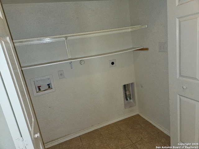 5334 Lowry Peterson, San Antonio, TX 78227 - laundry room with laundry area, electric dryer hookup, washer hookup, dark tile patterned floors, and baseboards