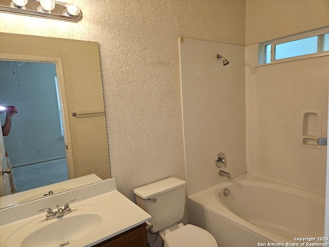 5334 Lowry Peterson, San Antonio, TX 78227 - full bathroom with toilet, bathing tub / shower combination, a textured wall, and vanity