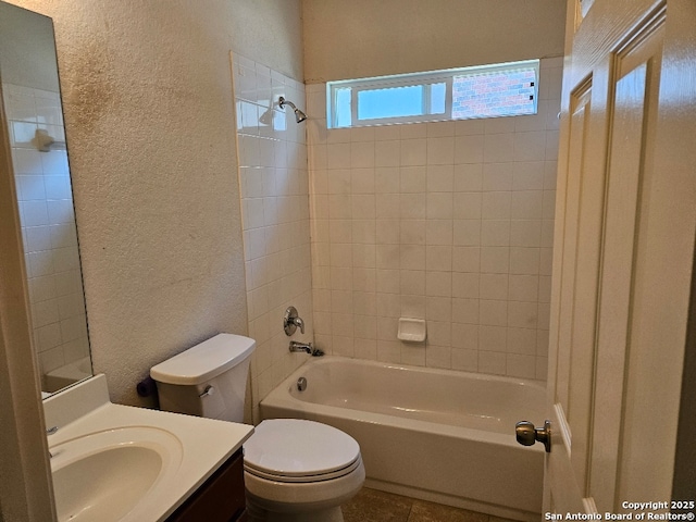 5334 Lowry Peterson, San Antonio, TX 78227 - bathroom featuring vanity, a textured wall, shower / bath combination, tile patterned floors, and toilet