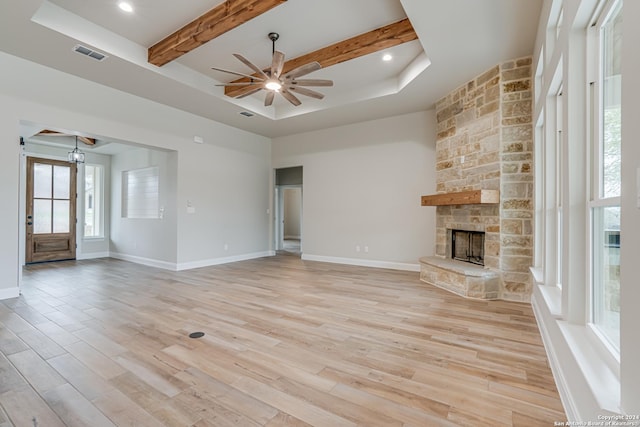 200 Bobby Lynn, Adkins, TX 78101 - unfurnished living room featuring visible vents, light wood-style flooring, ceiling fan, and a fireplace