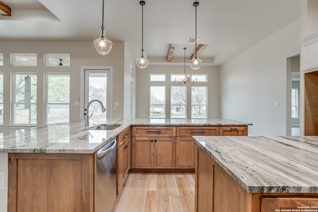 200 Bobby Lynn, Adkins, TX 78101 - kitchen with a raised ceiling, dishwasher, a sink, brown cabinets, and a large island with sink