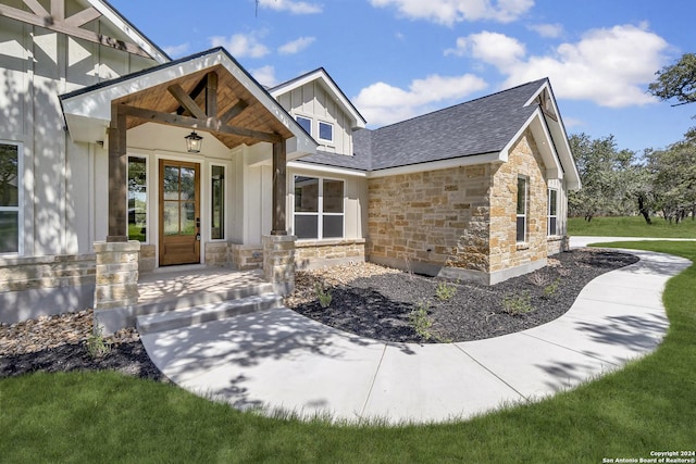 200 Bobby Lynn, Adkins, TX 78101 - doorway to property with board and batten siding, covered porch, and stone siding