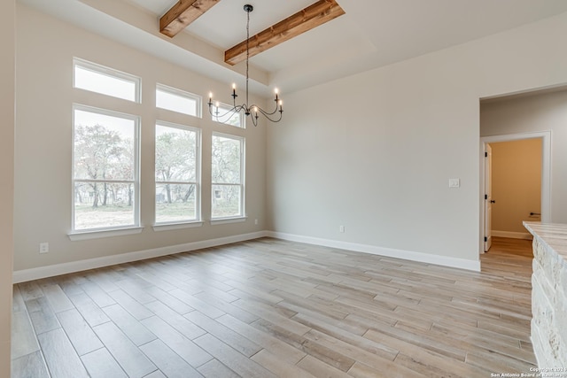 200 Bobby Lynn, Adkins, TX 78101 - spare room with beam ceiling, baseboards, light wood-type flooring, and a chandelier