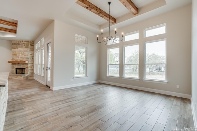200 Bobby Lynn, Adkins, TX 78101 - interior space with a chandelier, a fireplace, beamed ceiling, and a healthy amount of sunlight