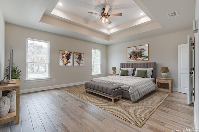 200 Bobby Lynn, Adkins, TX 78101 - bedroom featuring visible vents, baseboards, a tray ceiling, light wood finished floors, and recessed lighting