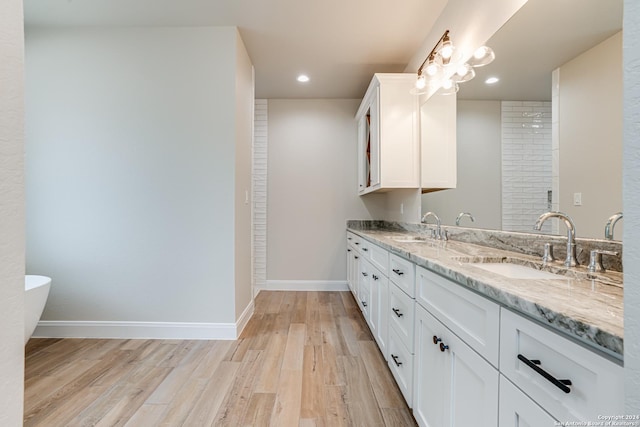 200 Bobby Lynn, Adkins, TX 78101 - full bath featuring a sink, baseboards, and wood finished floors
