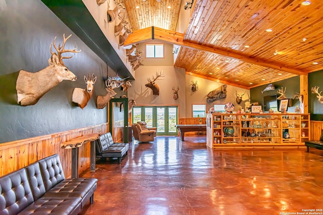 320 Overland Trl W, Hunt, TX 78024 - living area with wood ceiling, concrete floors, high vaulted ceiling, and a wealth of natural light