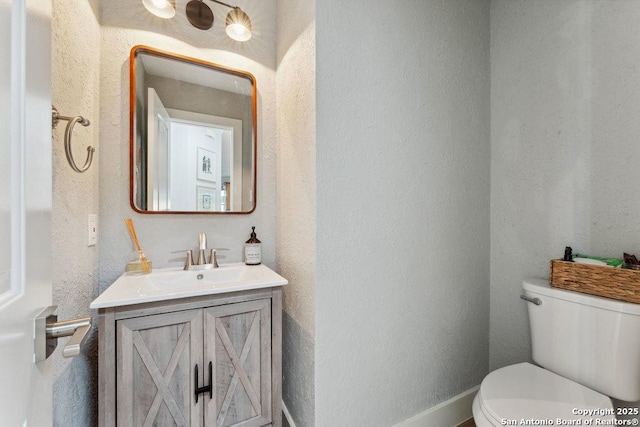 2047 Thicket Trail Dr, San Antonio, TX 78248 - bathroom with toilet, a textured wall, and vanity