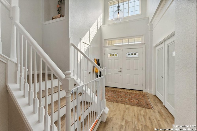 2047 Thicket Trail Dr, San Antonio, TX 78248 - foyer entrance featuring a high ceiling, wood finished floors, and stairs
