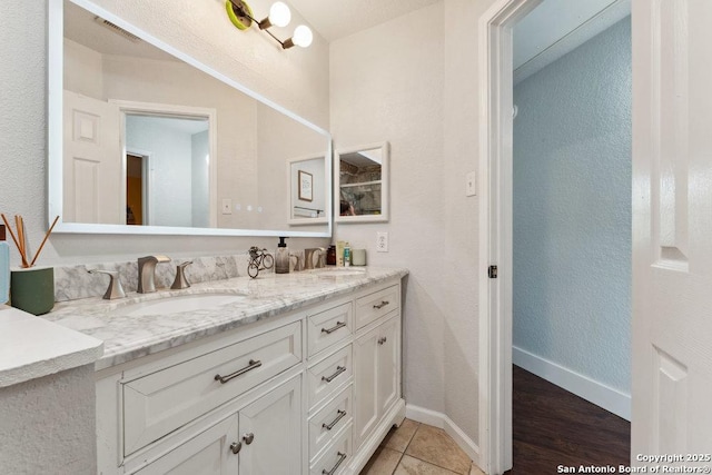 2047 Thicket Trail Dr, San Antonio, TX 78248 - bathroom with a sink, visible vents, baseboards, and double vanity