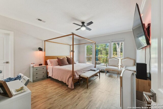 2047 Thicket Trail Dr, San Antonio, TX 78248 - bedroom featuring ornamental molding, light wood-style flooring, visible vents, and a textured ceiling