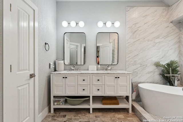 2047 Thicket Trail Dr, San Antonio, TX 78248 - full bathroom with a sink, baseboards, double vanity, and a soaking tub