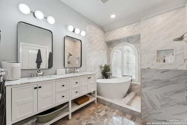 2047 Thicket Trail Dr, San Antonio, TX 78248 - bathroom with a soaking tub, double vanity, a sink, and walk in shower