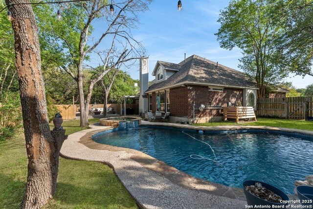 2047 Thicket Trail Dr, San Antonio, TX 78248 - view of pool with a patio, a fenced backyard, and a pool with connected hot tub