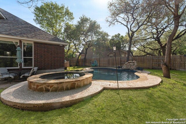 2047 Thicket Trail Dr, San Antonio, TX 78248 - view of swimming pool with a fenced backyard, a pool with connected hot tub, and a lawn