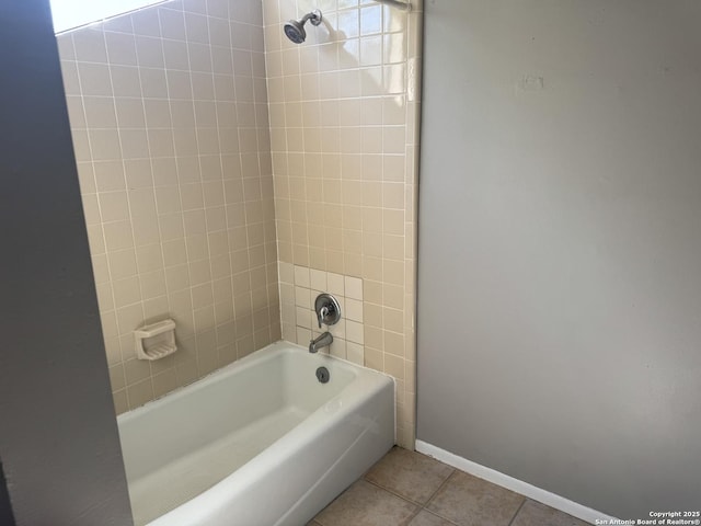 bathroom with baseboards, tile patterned flooring, and shower / bath combination