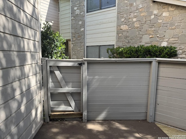 view of gate featuring fence