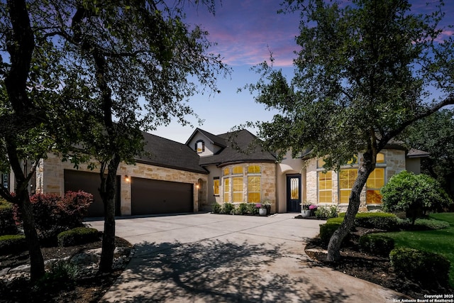4111 Monteverde Run, San Antonio, TX 78261 - french provincial home with roof with shingles, driveway, a garage, and stone siding