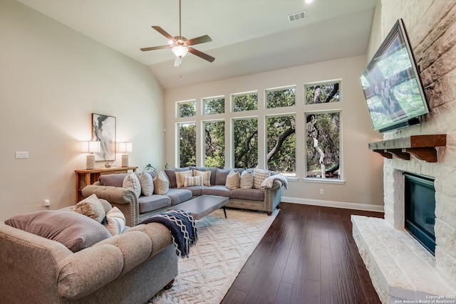 4111 Monteverde Run, San Antonio, TX 78261 - living room featuring a stone fireplace, baseboards, visible vents, ceiling fan, and wood-type flooring
